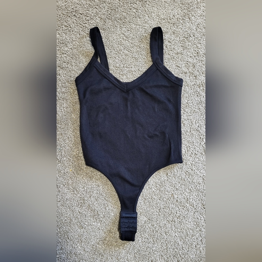 Dynamic black thong bodysuit